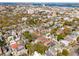 Expansive aerial view of a residential neighborhood with beautiful greenery and a distant bridge at 11 Franklin St, Charleston, SC 29401