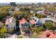 Aerial view showcases the neighborhood, featuring charming homes, mature trees, and city skyline at 11 Franklin St, Charleston, SC 29401