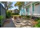 Serene backyard with brick patio, outdoor seating, and lush landscaping, creating a private retreat at 11 Franklin St, Charleston, SC 29401