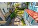 Charming backyard with lush lawn, brick patio, and seating area surrounded by mature trees and landscaping at 11 Franklin St, Charleston, SC 29401