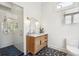 Stylish bathroom features a glass shower, modern vanity, and black and white geometric floor tiles at 11 Franklin St, Charleston, SC 29401