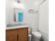 Neat bathroom with wood vanity, modern faucet, large mirror, white shower curtain, and tiled floor at 11 Franklin St, Charleston, SC 29401
