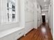 Hallway with built-in storage cabinets and hardwood flooring at 11 Franklin St, Charleston, SC 29401