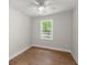This bedroom features a ceiling fan, wood floors, and a window with natural light at 1109 Hillside Dr, Charleston, SC 29407