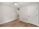 This bedroom features a ceiling fan, wood floors, access to the bathroom and a closet at 1109 Hillside Dr, Charleston, SC 29407