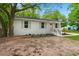 A white home with a new front door and beautiful trees at 1109 Hillside Dr, Charleston, SC 29407