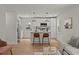 Open concept kitchen with a center island, stainless steel appliances, and updated lighting fixtures at 1109 Hillside Dr, Charleston, SC 29407