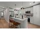 Bright kitchen featuring stainless steel appliances, modern pendant lighting, and white cabinetry at 1109 Hillside Dr, Charleston, SC 29407