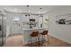 Eat-in kitchen featuring pendant lighting, white cabinets, stainless appliances and modern fixtures at 1109 Hillside Dr, Charleston, SC 29407