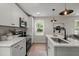 Stylish kitchen with white cabinets, stainless steel appliances, and an eat-in island at 1109 Hillside Dr, Charleston, SC 29407