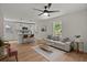 Open concept living space with freshly painted walls, updated fixtures, and hardwood-style floors at 1109 Hillside Dr, Charleston, SC 29407