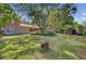 Expansive backyard featuring mature trees and lush green grass, perfect for outdoor enjoyment and relaxation at 113 Harvey Ave, Goose Creek, SC 29445