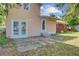 Exterior home view showcases backyard patio and manicured lawn at 113 Harvey Ave, Goose Creek, SC 29445