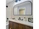 Elegant bathroom with a dark wood vanity, modern fixtures, and a large mirror at 113 Harvey Ave, Goose Creek, SC 29445