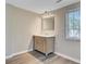 Bathroom featuring vanity with drawers and marble countertop and a large framed mirror at 113 Harvey Ave, Goose Creek, SC 29445