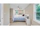 Bright bedroom with a ceiling fan, closet, and bedside table at 113 Harvey Ave, Goose Creek, SC 29445