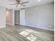 Neutral bedroom with new flooring, base trim, fresh paint, and an open doorway at 113 Harvey Ave, Goose Creek, SC 29445
