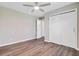 Spacious bedroom featuring wood floors, a ceiling fan, and ample closet space at 113 Harvey Ave, Goose Creek, SC 29445