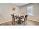 Charming dining room with a round table set for four, illuminated by natural light at 113 Harvey Ave, Goose Creek, SC 29445