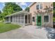 View of the home's exterior showcasing a porch, a green door, and clean yard at 113 Harvey Ave, Goose Creek, SC 29445