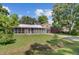 Charming home features a screened-in porch and well-maintained front yard at 113 Harvey Ave, Goose Creek, SC 29445