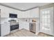 Modern kitchen featuring white cabinets and stainless steel appliances at 113 Harvey Ave, Goose Creek, SC 29445