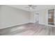 Spacious living room with new flooring, base trim, and neutral paint at 113 Harvey Ave, Goose Creek, SC 29445