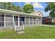 Home exterior featuring screened in porch and well-kept backyard at 113 Harvey Ave, Goose Creek, SC 29445