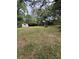 Expansive backyard featuring mature trees, a storage shed, and a gazebo for outdoor relaxation and entertainment at 1130 Yeamans Hall Rd, Hanahan, SC 29410