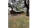 Fenced backyard with mature trees surrounding the perimeter at 1130 Yeamans Hall Rd, Hanahan, SC 29410