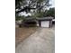 Brick home featuring an attached garage and a covered parking area at 1130 Yeamans Hall Rd, Hanahan, SC 29410