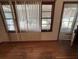 Empty living room featuring wood floors and natural light from the front windows at 1130 Yeamans Hall Rd, Hanahan, SC 29410
