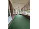 Spacious screened-in porch with neutral tones and ample natural light at 1130 Yeamans Hall Rd, Hanahan, SC 29410