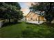 Backyard view of the sunroom, shed and fenced in yard at 1136 Peninsula Cove Dr, Charleston, SC 29492