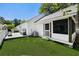 Backyard view of the back of the house and screen porch at 1136 Peninsula Cove Dr, Charleston, SC 29492