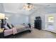 Comfortable bedroom with a vaulted ceiling, soft carpeting, and a calming color palette for a relaxing ambiance at 1136 Peninsula Cove Dr, Charleston, SC 29492