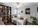 Cozy bedroom featuring a comfortable bed, built-in shelving, and a calming color scheme at 1136 Peninsula Cove Dr, Charleston, SC 29492