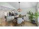 Open dining space with a view of the modern kitchen, pendant lighting, and stylish decor at 1136 Peninsula Cove Dr, Charleston, SC 29492