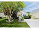 Charming single-story home featuring a well-manicured lawn and inviting front entrance with a classic white door at 1136 Peninsula Cove Dr, Charleston, SC 29492