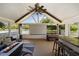 Beautiful outdoor living space with fire pit, bar, and lake views at 1136 Peninsula Cove Dr, Charleston, SC 29492