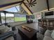 Cozy outdoor living space with fire pit, projector and lake views at 1136 Peninsula Cove Dr, Charleston, SC 29492