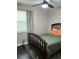 Light-filled bedroom with neutral walls, a brown bed and modern curtains at 117 Fripp Ln, Summerville, SC 29483