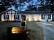 Charming home with black and white exterior and solar panels on the roof at 117 Fripp Ln, Summerville, SC 29483