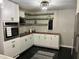Modern kitchen featuring white cabinets, wood countertops, and stainless steel appliances at 117 Fripp Ln, Summerville, SC 29483