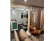 Open-concept living room leading into a dining area, with modern furnishings and decor at 117 Fripp Ln, Summerville, SC 29483
