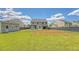 Expansive backyard showcasing the home's exterior, patio, shed, and lush lawn at 122 Balsam Cir, Summerville, SC 29485