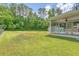 Spacious backyard featuring a screened porch, storage shed, and lush greenery at 122 Balsam Cir, Summerville, SC 29485