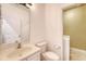 Bright bathroom with white vanity and a laundry room at 122 Balsam Cir, Summerville, SC 29485