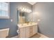 Bathroom featuring double sinks, a large mirror with lights, a toilet, and walk in shower at 122 Balsam Cir, Summerville, SC 29485