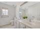 Bathroom featuring a dual sink vanity, and a window at 122 Balsam Cir, Summerville, SC 29485